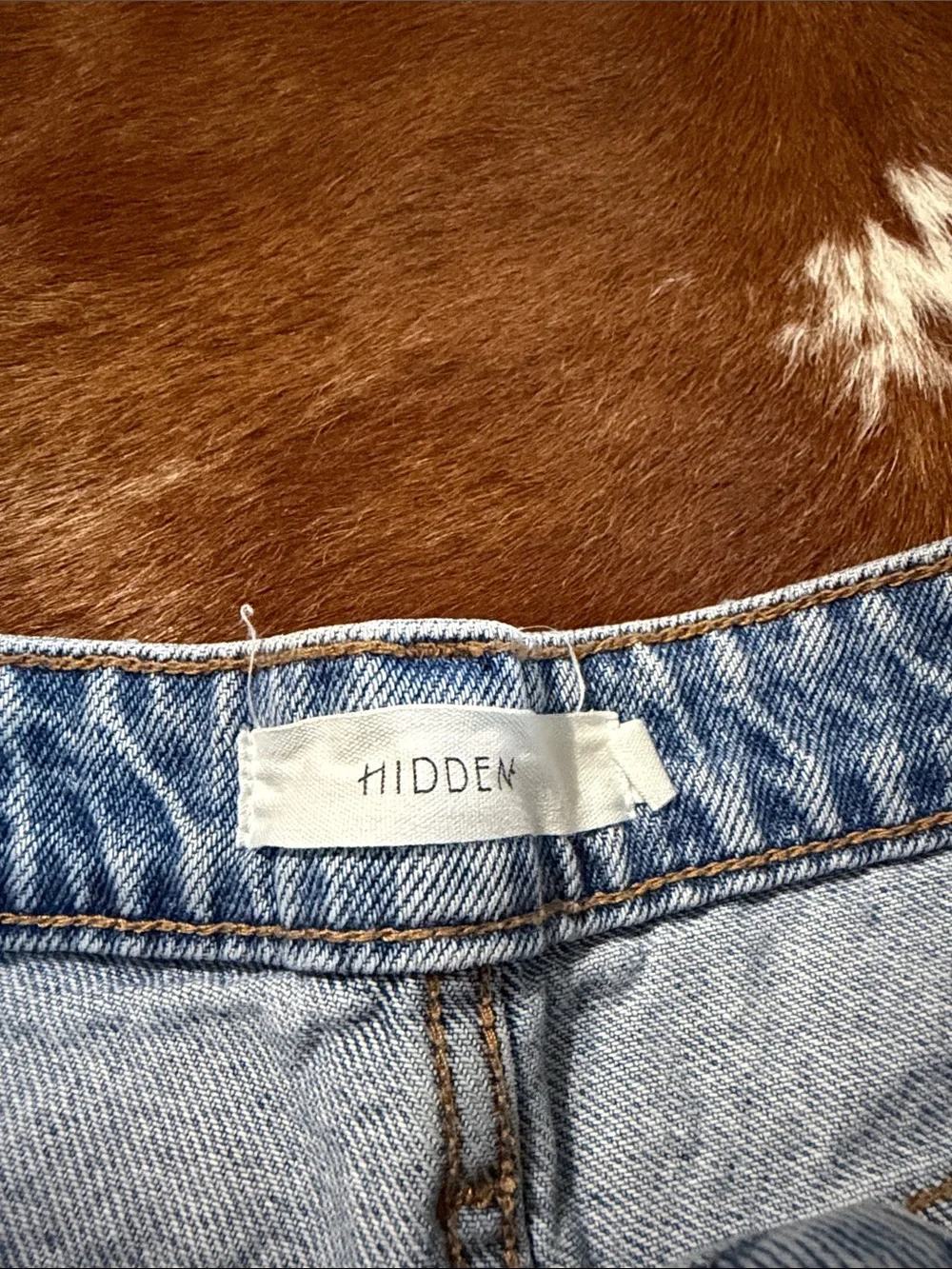 High-Rise Light Blue Distressed Denim Shorts